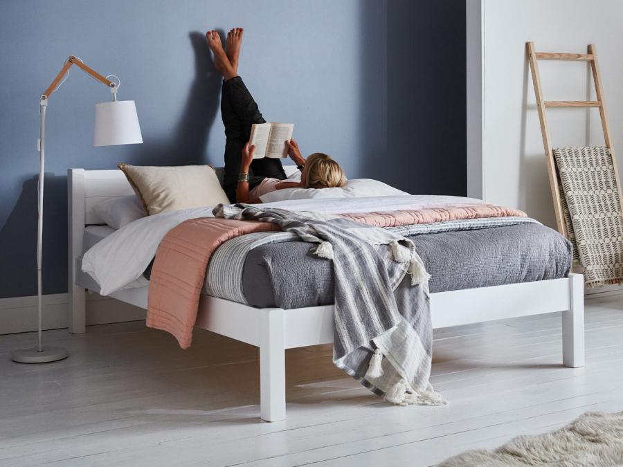 white wooden white knight bed frame